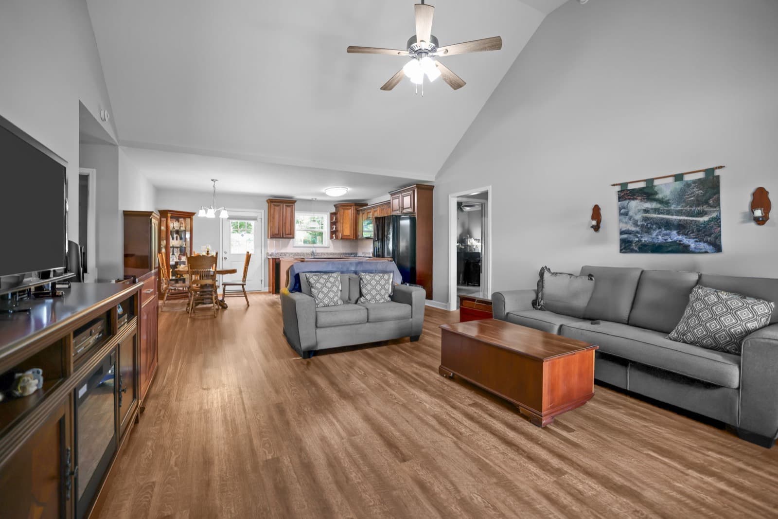 Vaulted living room with wood floors in a Shelbyville TN home marketed by The Coffey Collection